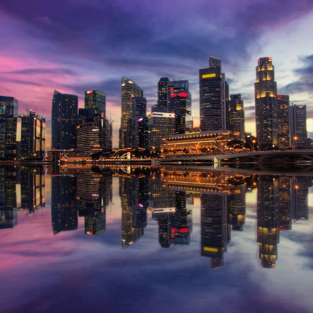 Skyline and banking district illustrating Singapore versus Hong Kong 2026 booking centres